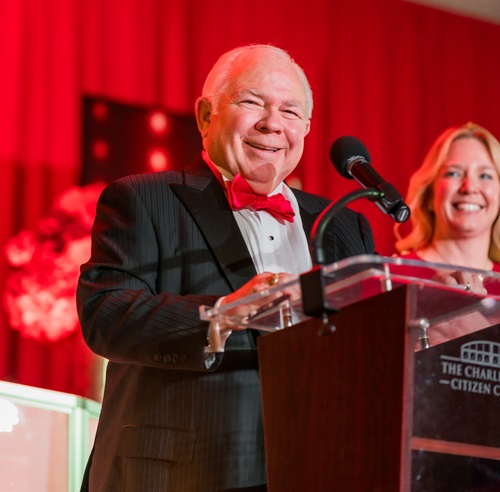 Man in red bow tie at the speaker's podium.